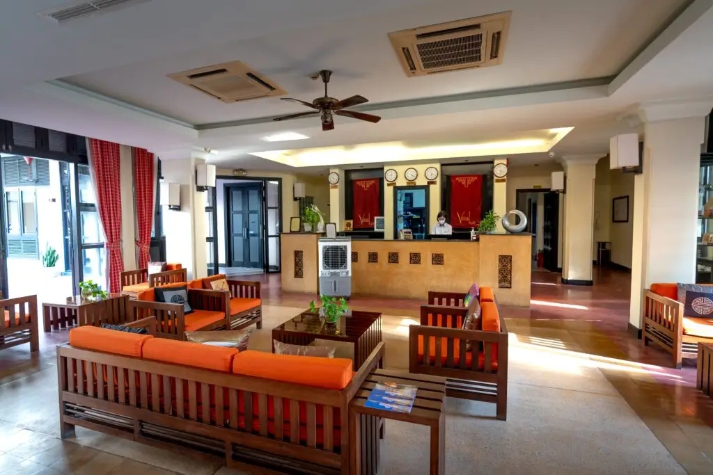 Inviting hotel reception with a warm, contemporary design and vibrant seating.